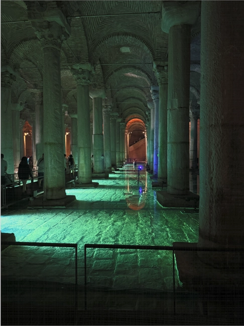 Wide view of Basilica Cistern with columns lit by green lights