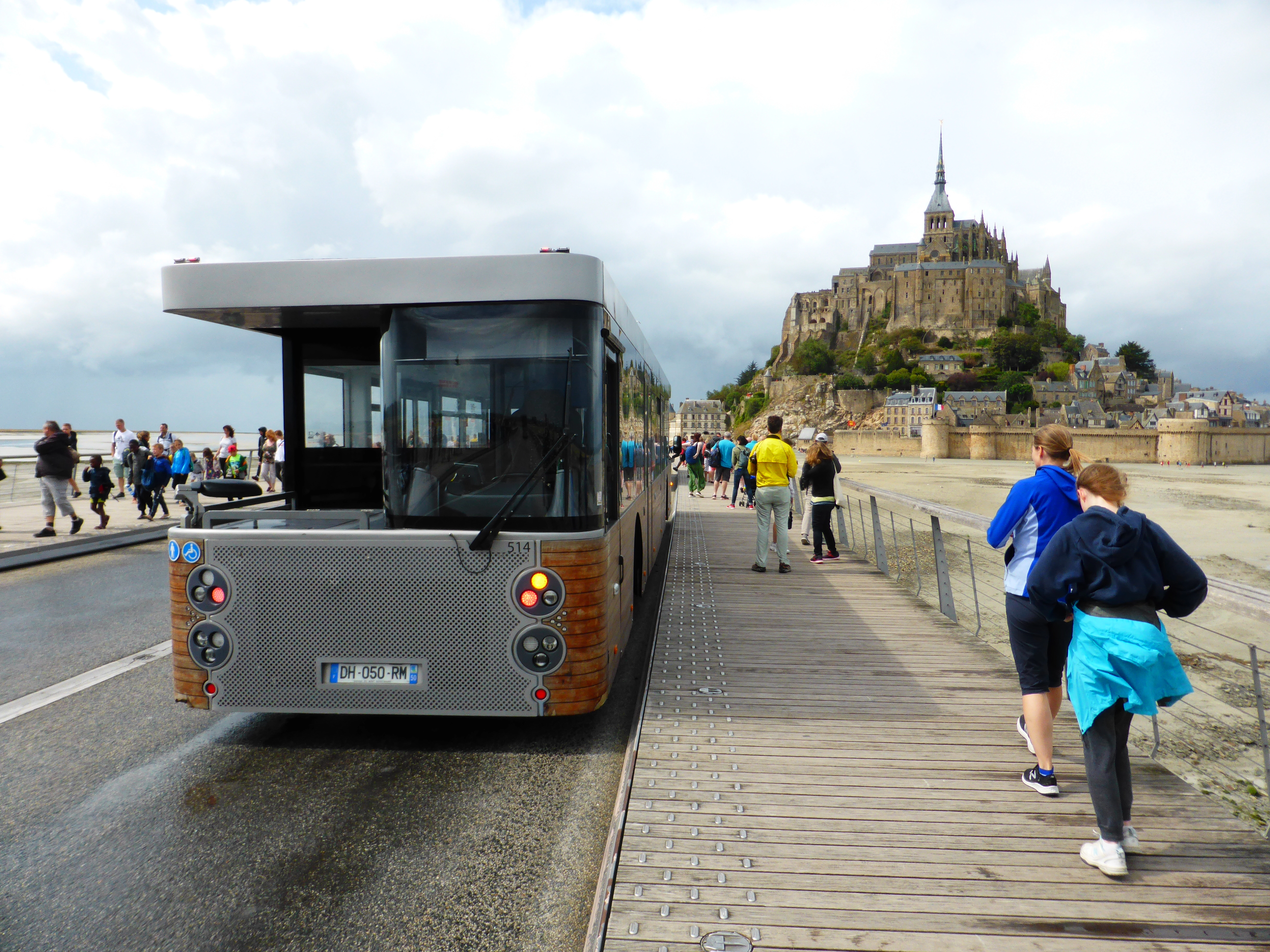 Modern shuttle bus “Le Passeur” parked near Mont-Saint-Michel, designed with dual driver cabins for efficient travel to the island.